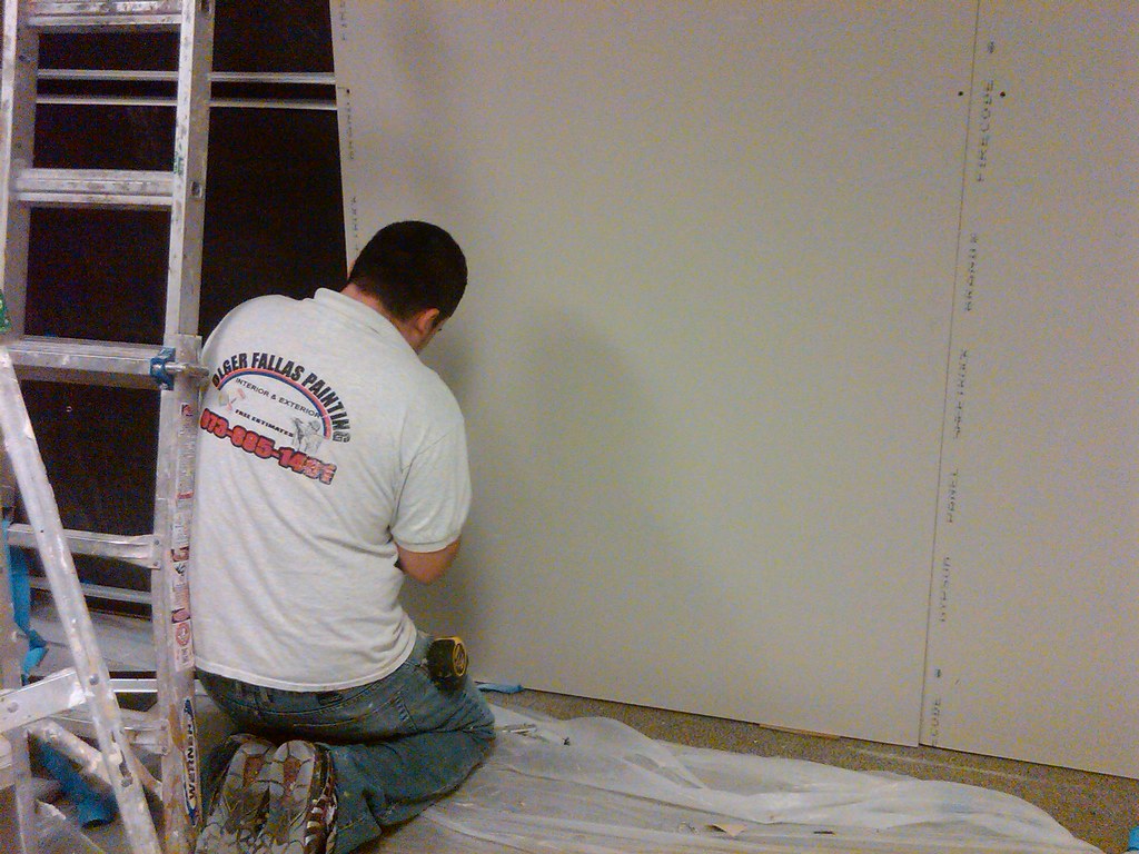 A wall with visible drywall seams.
